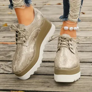 Elegante plateausneakers van slangenleer