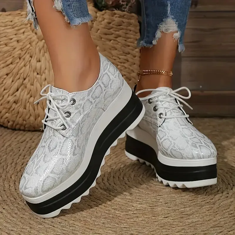 Elegante plateausneakers van slangenleer
